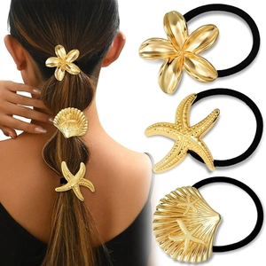 Minimalist gold metal hair ties set featuring flower, starfish, and seashell charms
