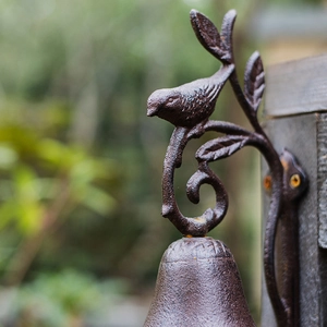 European vintage cast iron wall bell with bird and leaf ornament for garden decor