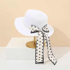 French straw sun hat with elegant pearl band and polka dot ribbon bow decoration