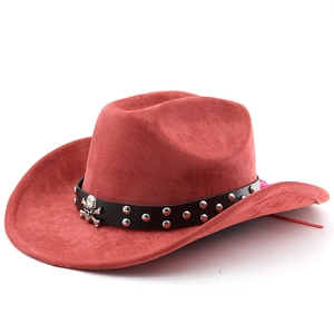 Detail of red suede cowboy hat with black leather band, silver studs and skull ornament