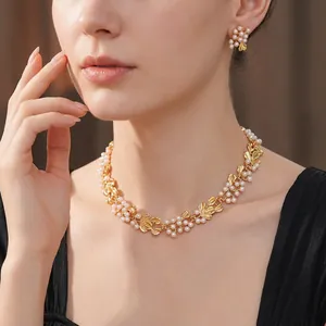 Vintage gold-tone flower and pearl necklace with matching earrings set for women