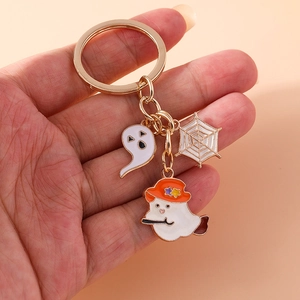 Halloween ghost and spider web keychain in gold alloy with orange enamel charms
