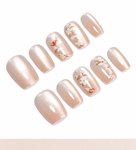 Détails de faux ongles œil-de-chat champagne avec motifs floraux peints à la main