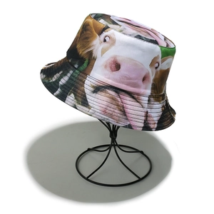 Detailed view of the cow print bucket hat showing fabric texture and reinforced brim stitching
