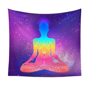 Close-up of meditation silhouette tapestry with lotus mandala and galaxy background