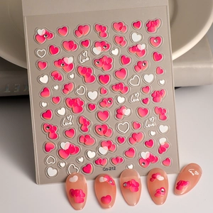 Detail of 3D embossed heart nail stickers with Love text and tiny rhinestones