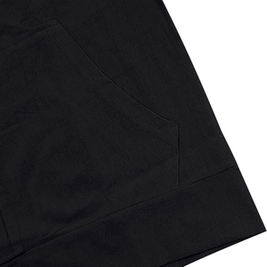 Detail shot of double-needle stitching and pocket seam on black linen hoodie set