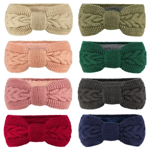 Close-up of winter knit headbands in eight colors with warm plush lining and bow design