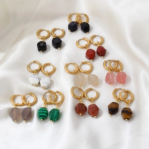 Set of 10 pairs of geometric natural stone drop earrings with gold hoops on white silk