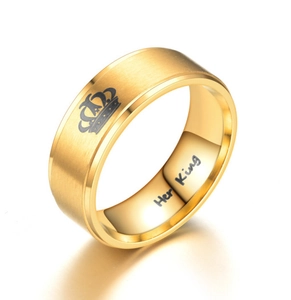 Detailed macro shot of golden crown couple ring featuring Her King interior engraving