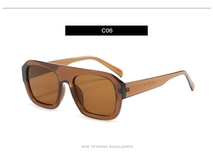 Detail view of transparent brown oversized flat top sunglasses with integrated nose pads