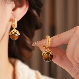 Gold plated tiger eye earrings with zircon accents in vintage luxury style