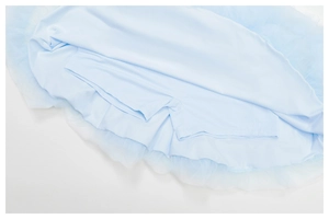 Detail of light blue mesh yoga skirt with built-in breathable high-stretch safety shorts