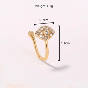 Detailed view of gold U-shaped nose ring with evil eye charm and sparkling zircons