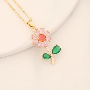 Elegant gold flower necklace with colorful pink, orange and green zircon crystals
