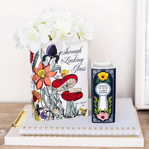Creative book-shaped ceramic flower vases featuring Alice in Wonderland and Secret Garden art