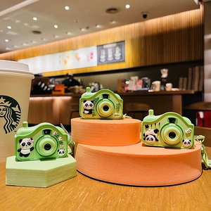 Three green panda camera keychains with LED projection and cute cartoon panda illustration