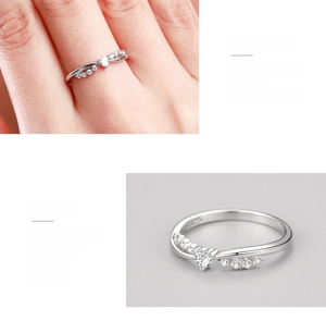 Macro detail of S925 sterling silver heart ring with sparkling cubic zirconia settings