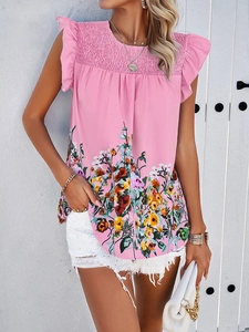 Detail of pink sleeveless floral top featuring ruffled chest and flutter sleeves
