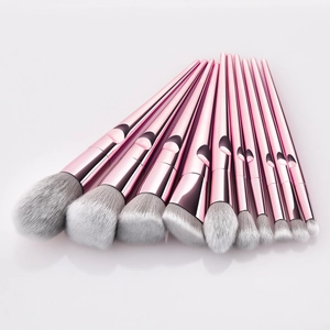 Professional 11pcs pink metal handle makeup brush set with gradient bristles on white background