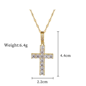 Macro shot of gold cross necklace with square cubic zirconia and dimensions 4.4x2.2cm