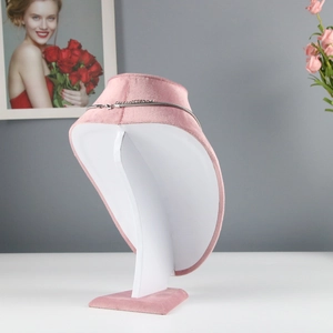 Detailed side view of pink velvet necklace display stand with premium soft texture