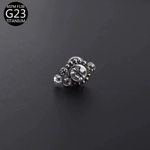 G23 titanium labret stud with five sparkling zircon stones and ASTM F136 certification logo