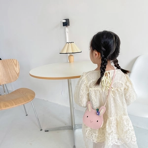 Cute pink bunny-shaped shoulder bag for kids with adjustable strap and lovely floral detail