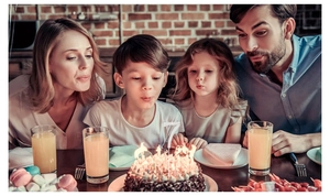 Family birthday scene showing a silver rhinestone number 7 cake topper on a cake