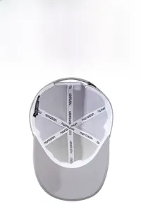Internal view showing breathable mesh lining and brand webbing of the grey baseball cap