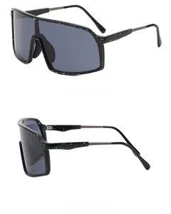 Detail of outdoor cycling sunglasses featuring black frame with white speckled star patterns