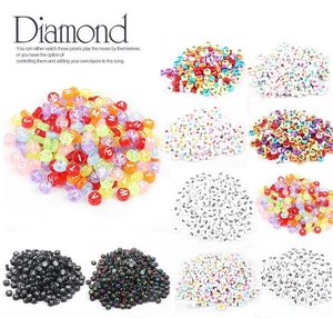 Macro detail of assorted 4x7mm acrylic alphabet beads for DIY jewelry making sets
