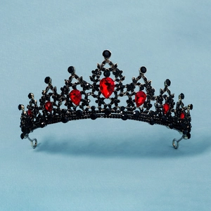 Close-up of baroque bridal crown featuring vintage black crystals and red water-drop gems