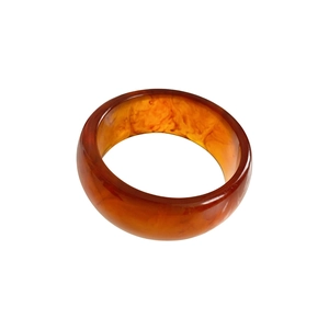 Minimalist wide amber resin bangle featuring vibrant orange swirled marble texture