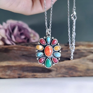 Bohemian silver necklace featuring a vibrant multi-color gemstone flower pendant