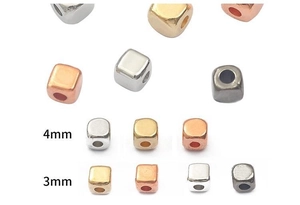 Macro view of 3mm and 4mm CCB square cube beads for DIY jewelry in gold and silver