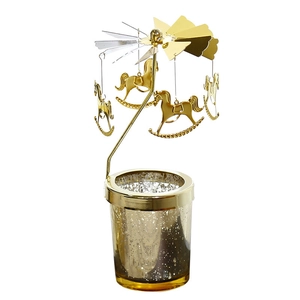 Golden spinning carousel candle holder with horse charms and speckled glass cup