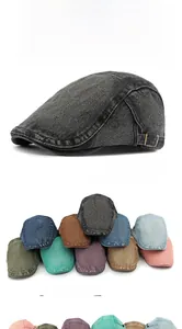 Detailed view of washed denim beret cap featuring adjustable metal buckles and multiple colors