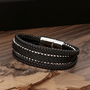 Black multilayer braided leather bracelet for men with silver studs on wood and stones