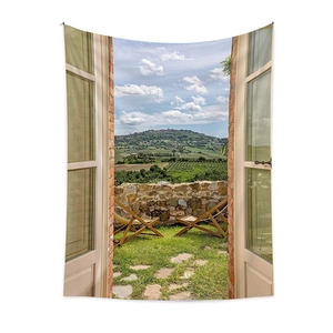 Detail of bohemian tapestry fabric showing realistic Tuscany vineyard landscape with lounge chairs