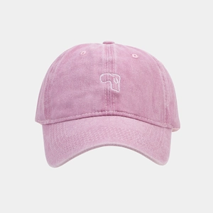 Detailed view of pink washed cotton baseball cap with delicate white line embroidery