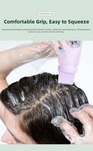 Detail of purple hair dye squeeze bottle with comb applicator for easy coloring at home