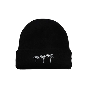 Black knit beanie featuring white embroidered coconut trees in a trendy minimalist style