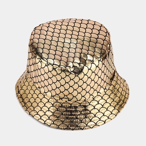 Detailed top view of gold fish scale bucket hat with metallic texture and black outlines