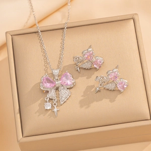 Elegant silver bow jewelry set with pink heart gems and zircon star pendant in a gift box