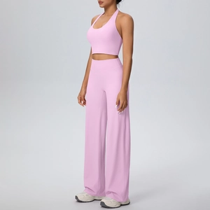 Detail view of pink brushed halter sports bra and high-waisted wide-leg yoga pants set