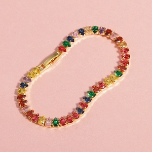 Detailed macro view of 18K gold-plated bracelet with multi-color pear-cut zircons