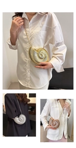 Detailed view of snail shell shaped metallic clutch bag in gold silver and rose gold finishes
