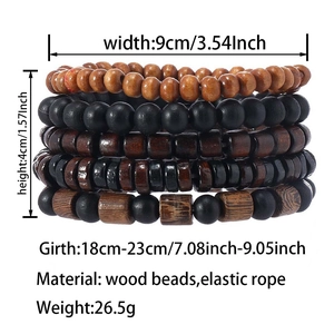 Detail of five stacked vintage wooden bead bracelets in mixed colors and elastic rope texture