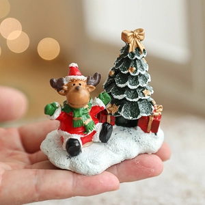 Miniature Christmas resin figurines set featuring reindeer, tree, and gift box ornaments